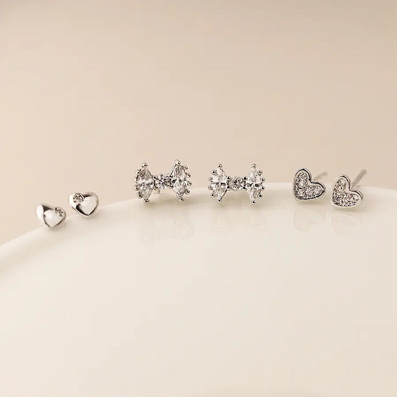 Crystal bow and heart studs